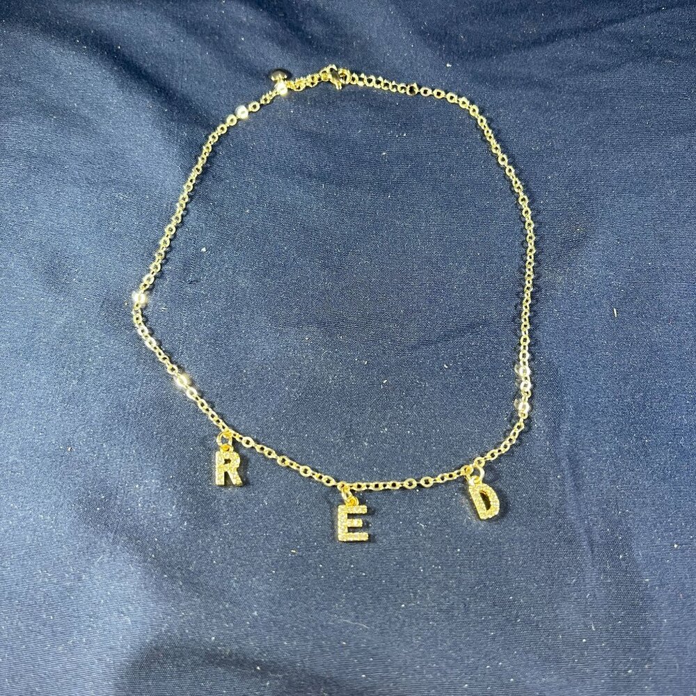 Gold-Tone Chain Necklace With "R E D" Letter Charms & Heart Detail